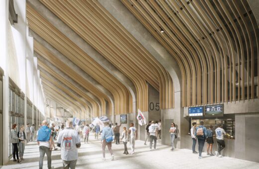 Indendørs stadion med fans, moderne træpaneler og folk i sportstøj ved indgang 05.