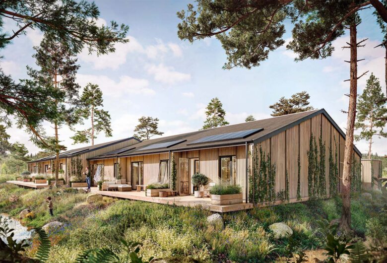 Moderne træbygninger i naturskønt område med solpaneler på taget og grønne omgivelser.
